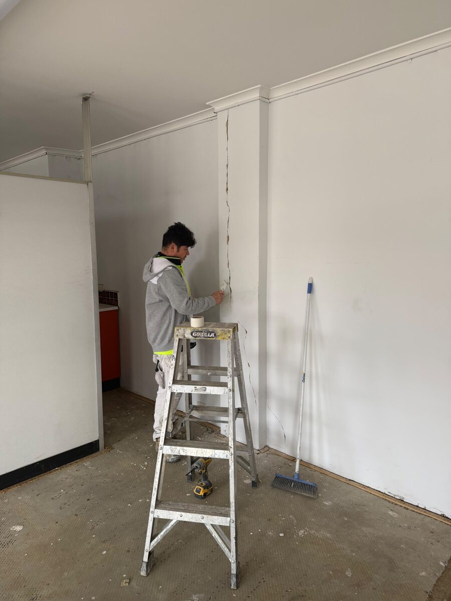 Interior wall being prepared before painting