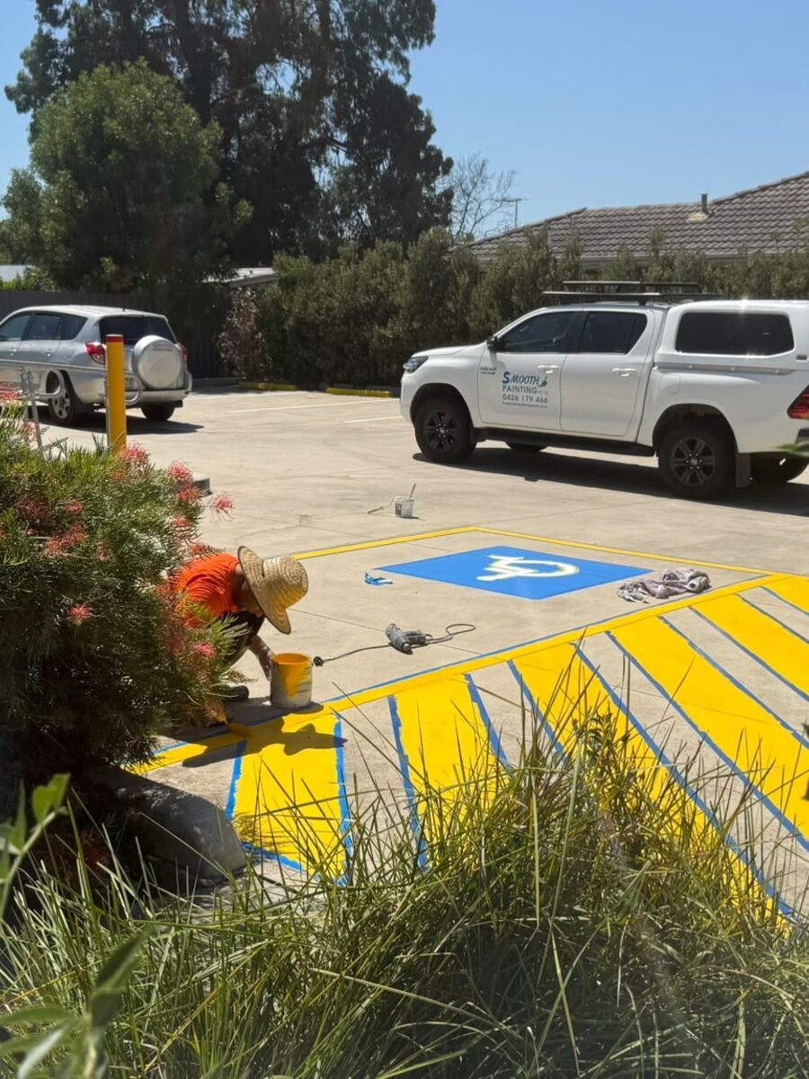 Worker line marking a car park bay
