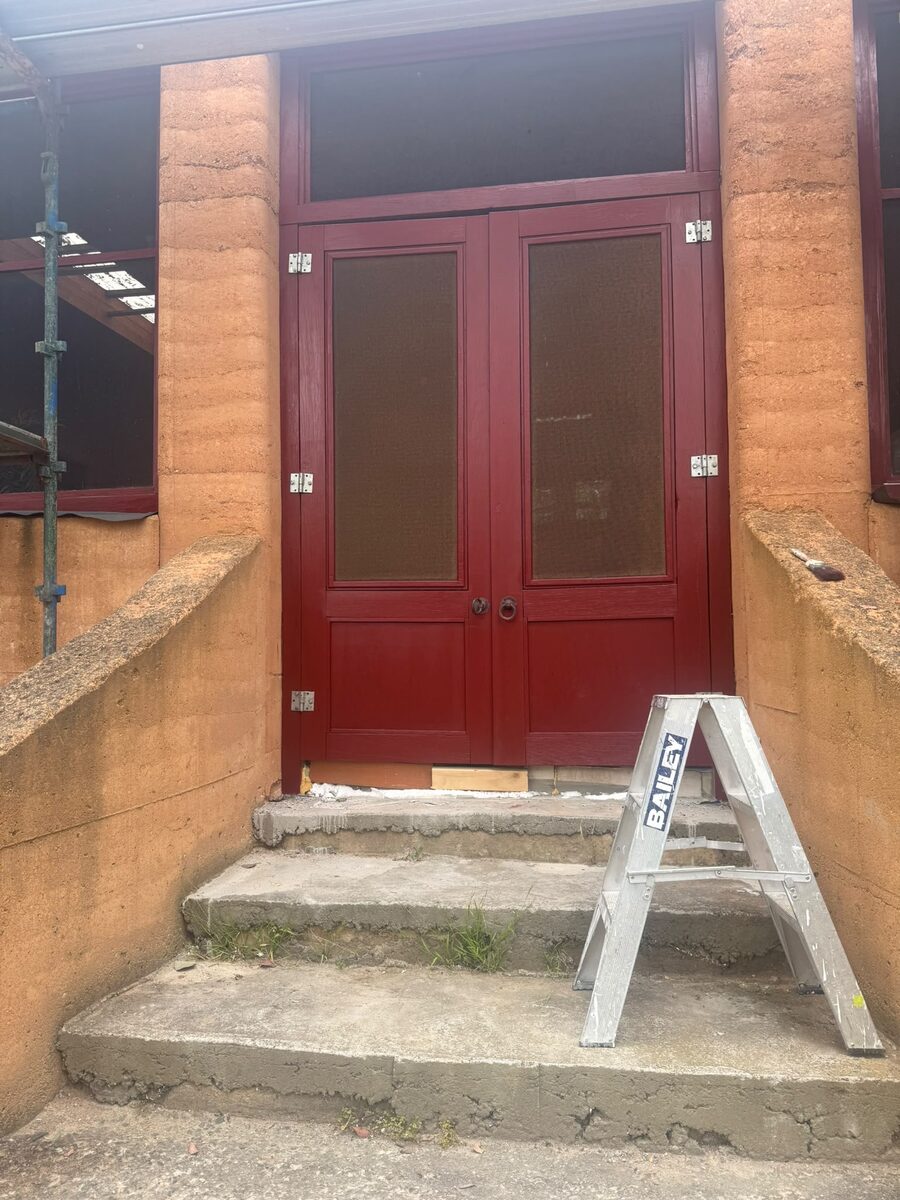 Red entry doors before repainting